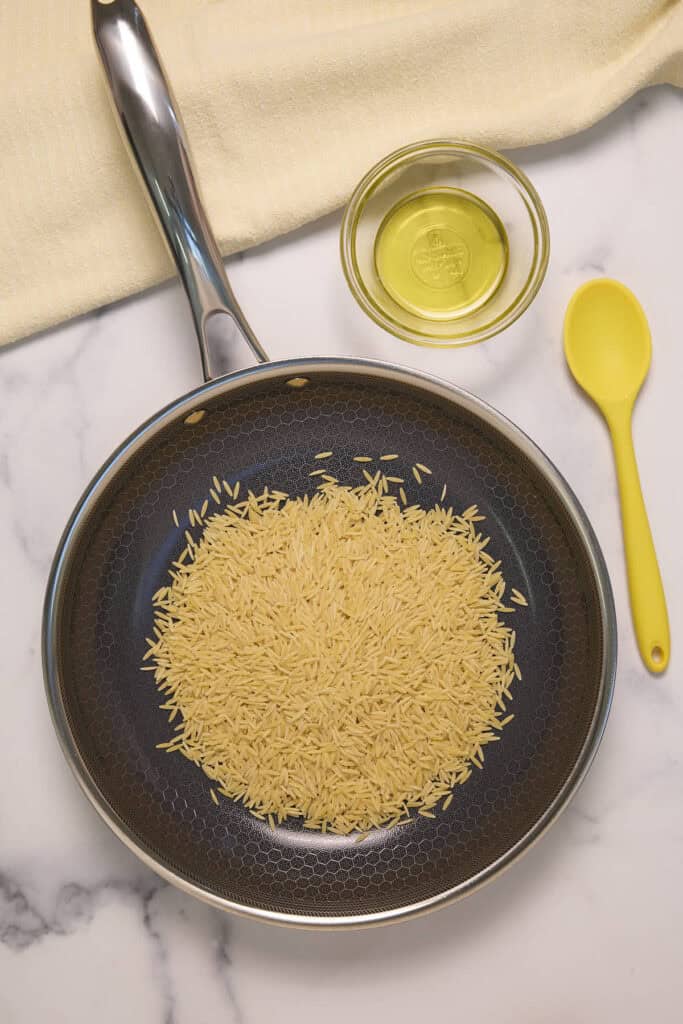 toasting the orzo in a skillet with some olive oil before cooking helps devlop flavor and texture
