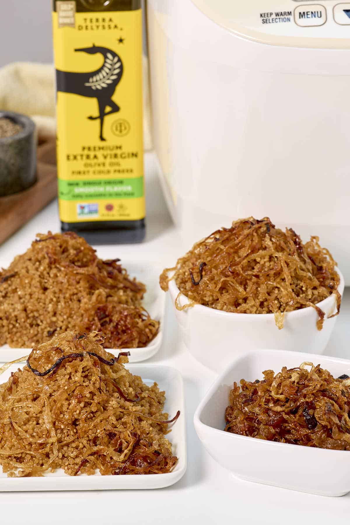 Small plates of carmelized onions with dishes of our french onion quinoa