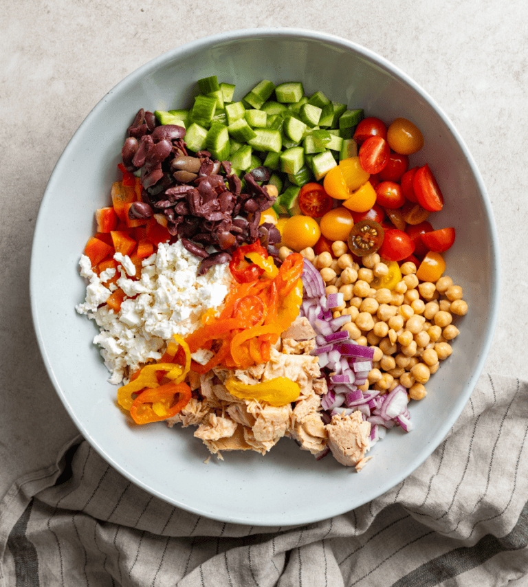 Ingredients for a tuna greek salad in a bowl