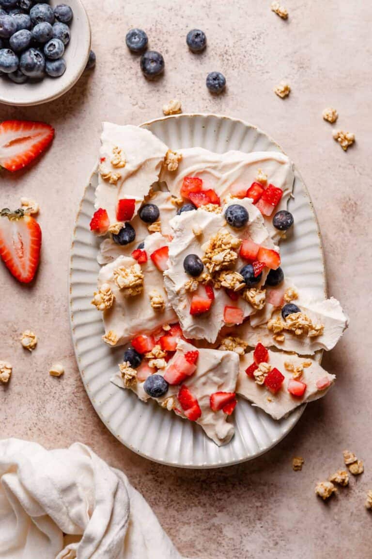 Yogurt bark with berries and granola served on a dish