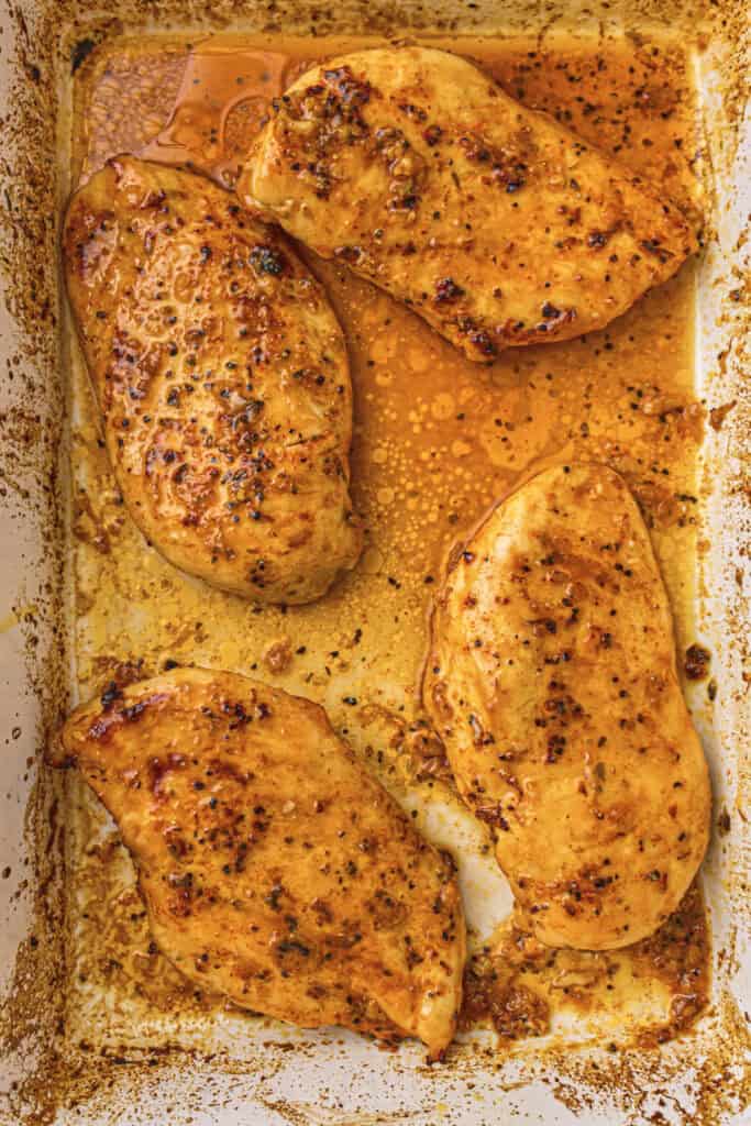 Almost finished chicken breasts in the baking dish