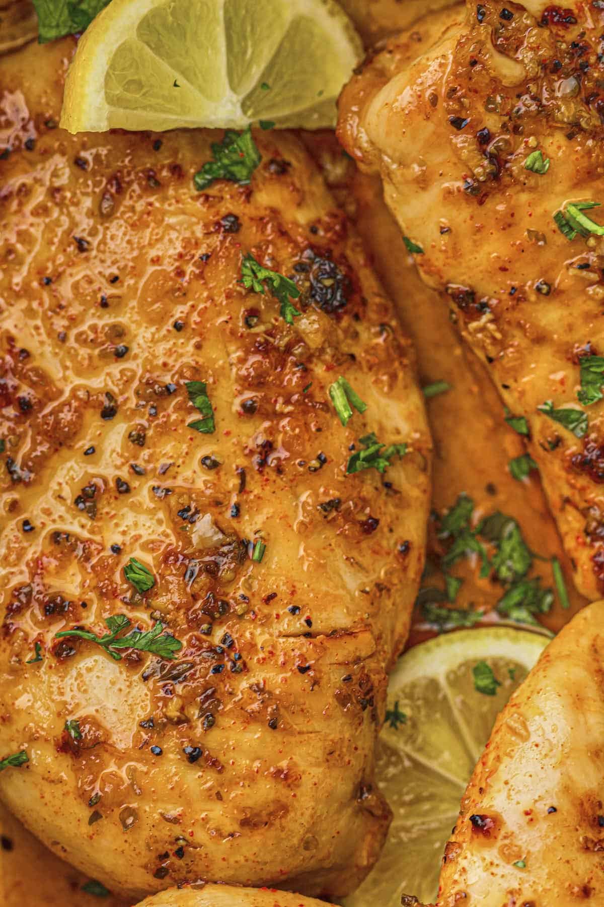 Close up of the finished baked lemon chicken breasts from this recipe