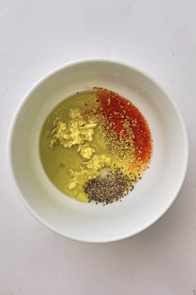 The ingredients of the marinade in a bowl