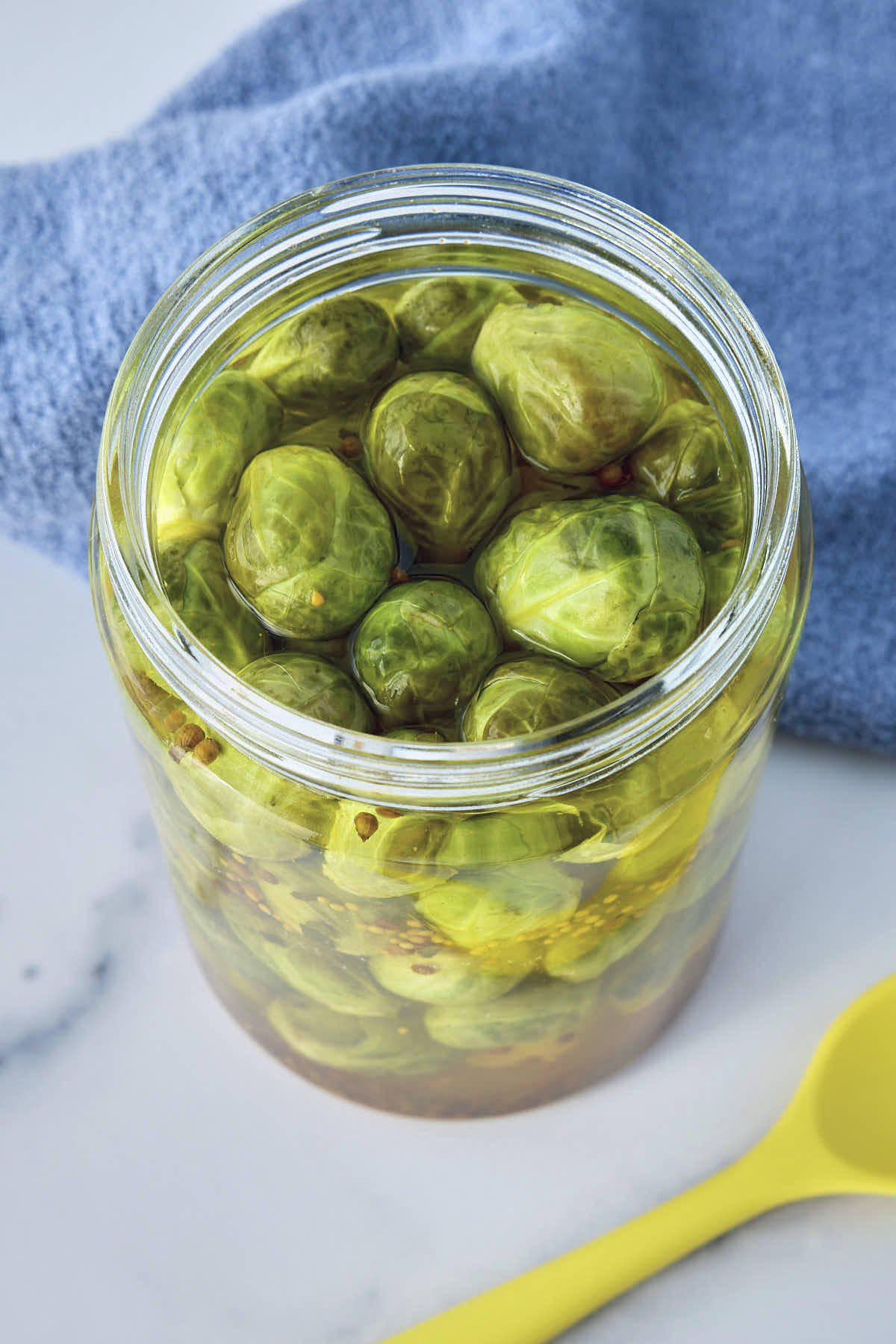 A jar full of finished pickled Brussels sprouts