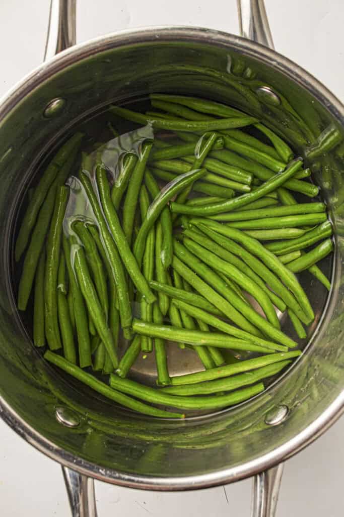 Green beans in a pot of water for blanching them