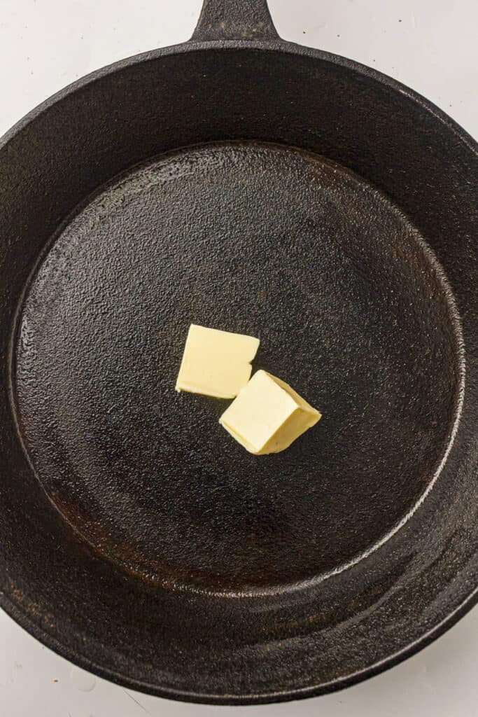 Butter in a cast iron skillet