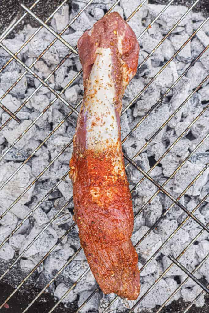 Pork tenderloin on the grill over hot coals