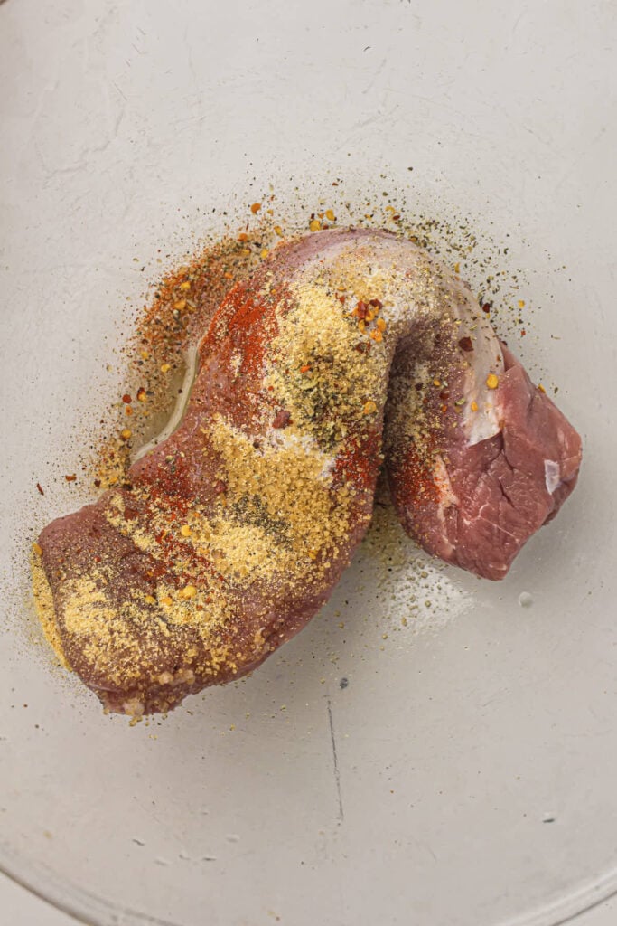 Seasoning the pork tenderloin