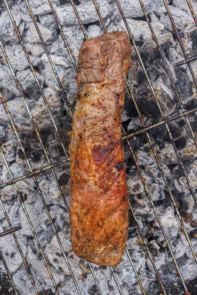 Seared pork tenderloin ready to finish over indirect heat