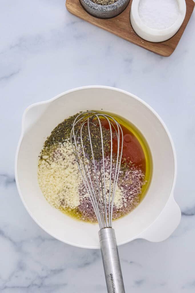 The dressing ingredients in a bowl ready to be whisked