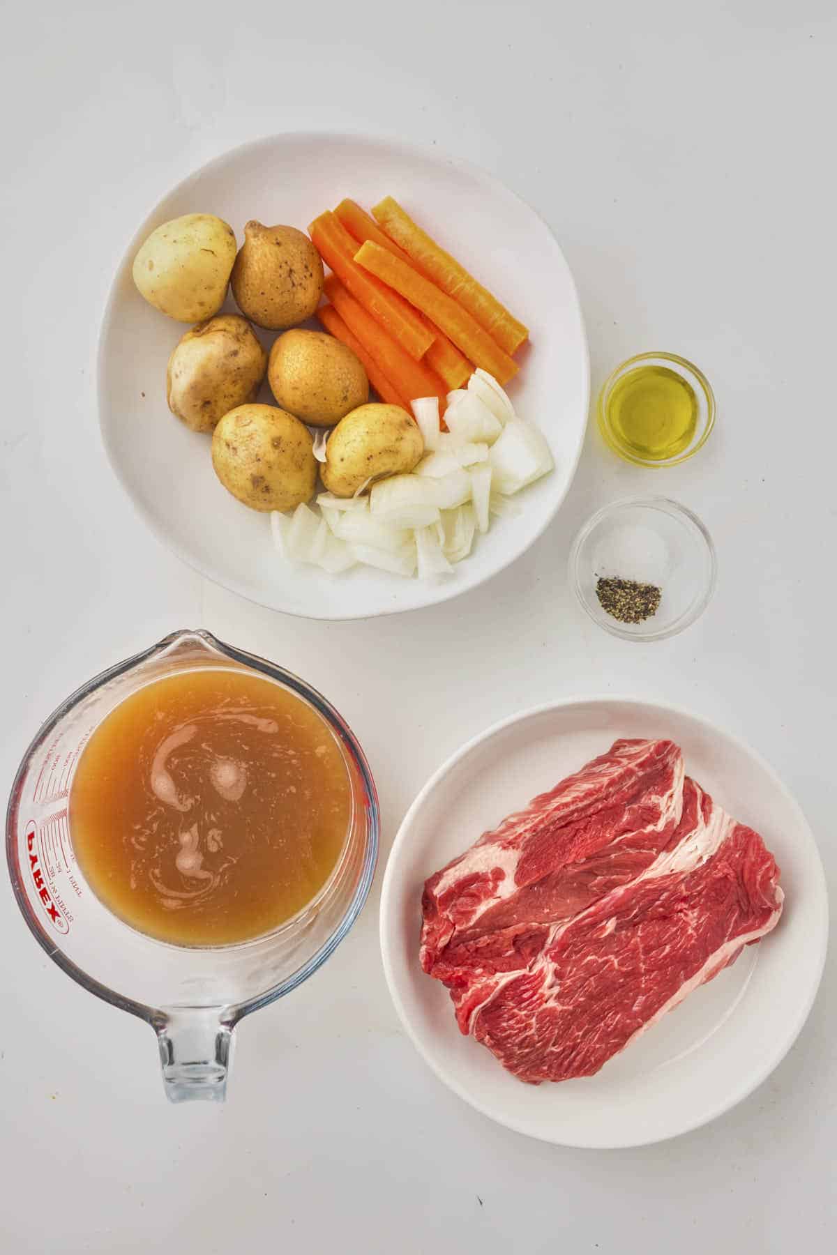 Ingredients for this pot roast recipe with assorted veggies and a medium siced chuck roast of about three pounds weight