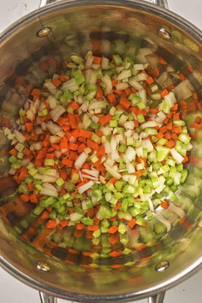 Carrots, celery, and onions in a pot