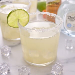 low carb margarita with salt on the rim and garnished with a slice of lime
