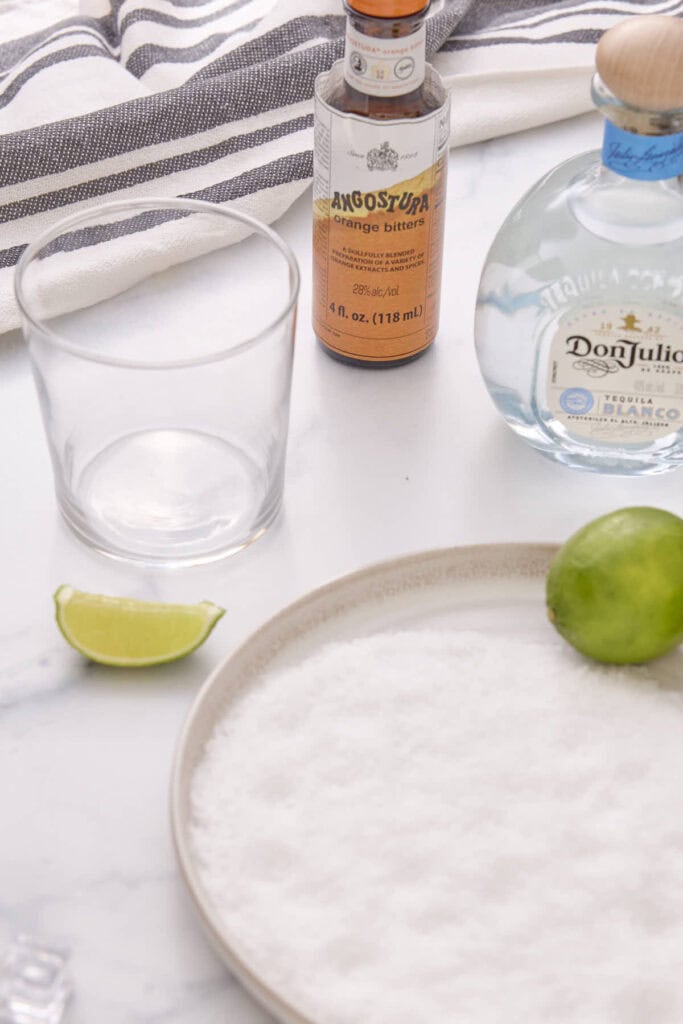 a wedge of lime used to moisten the rim of a glass so the salt will adhere