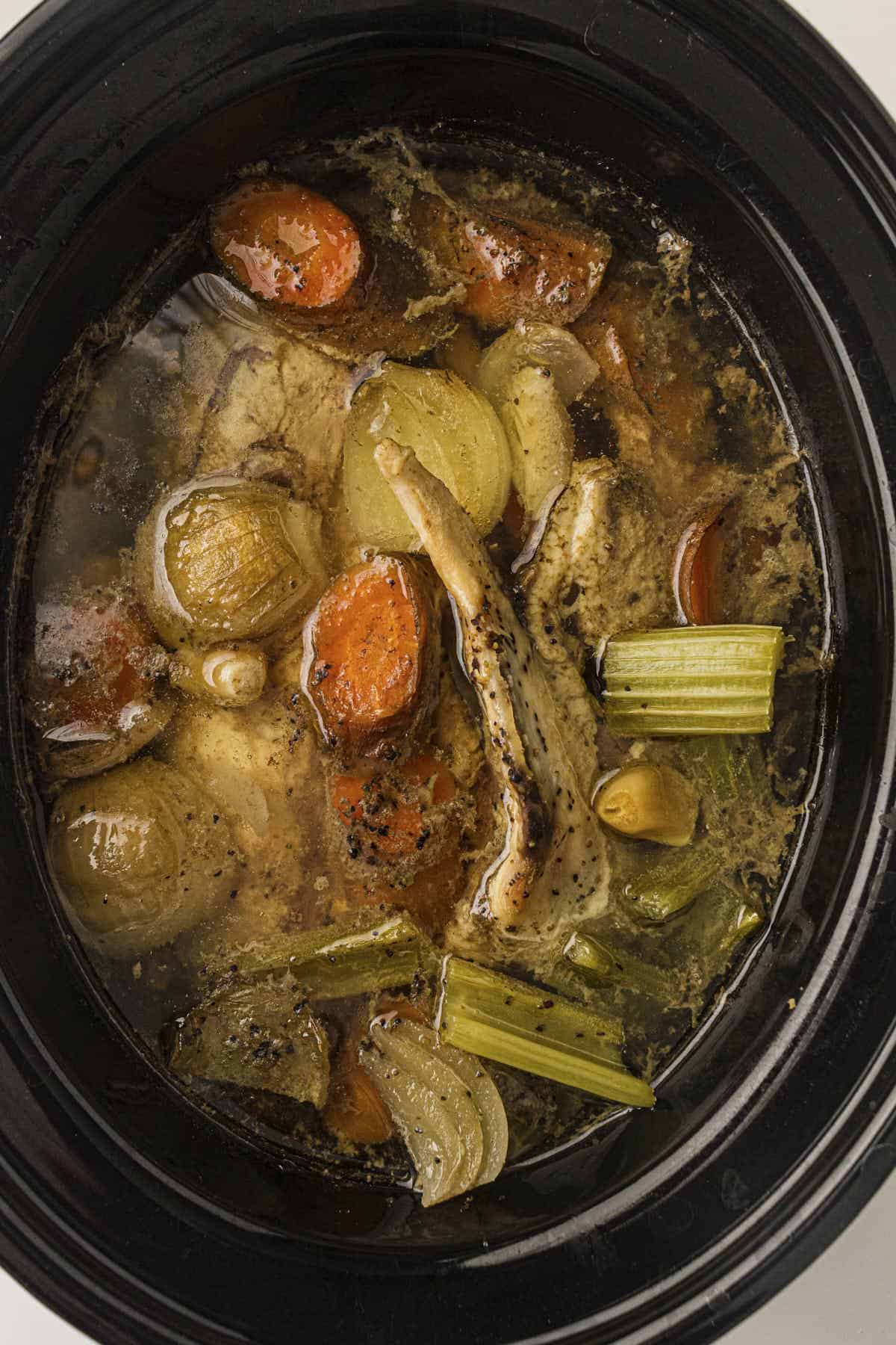 Chicken stock cooled down and ready to be strained