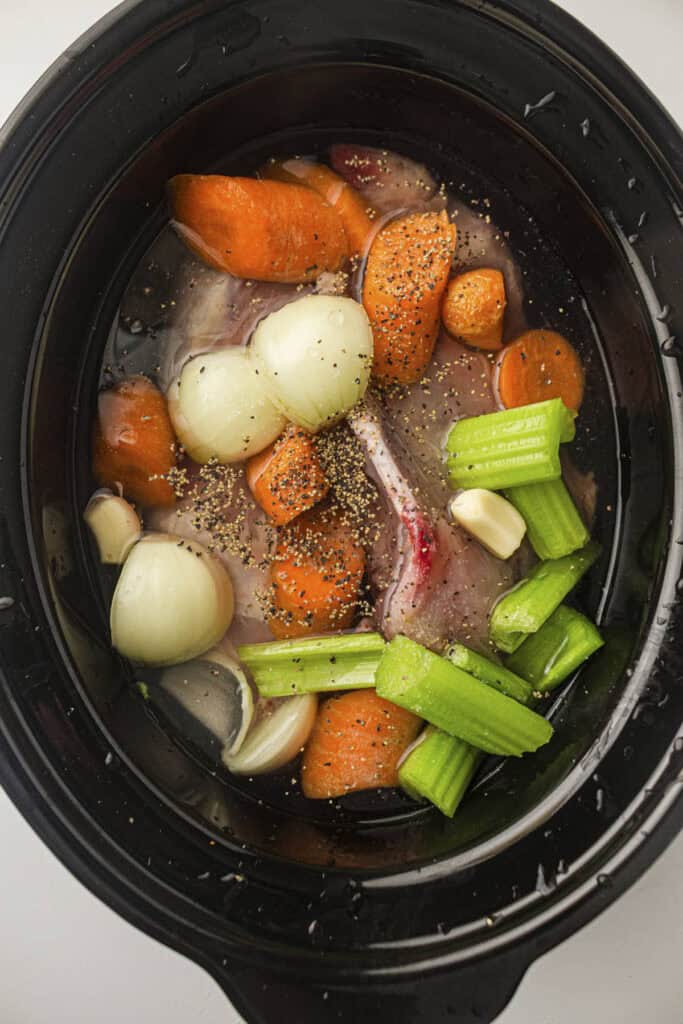 Process photo showing the seasoning being added to the pot