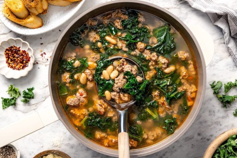A bowl of white bean soup with sausage